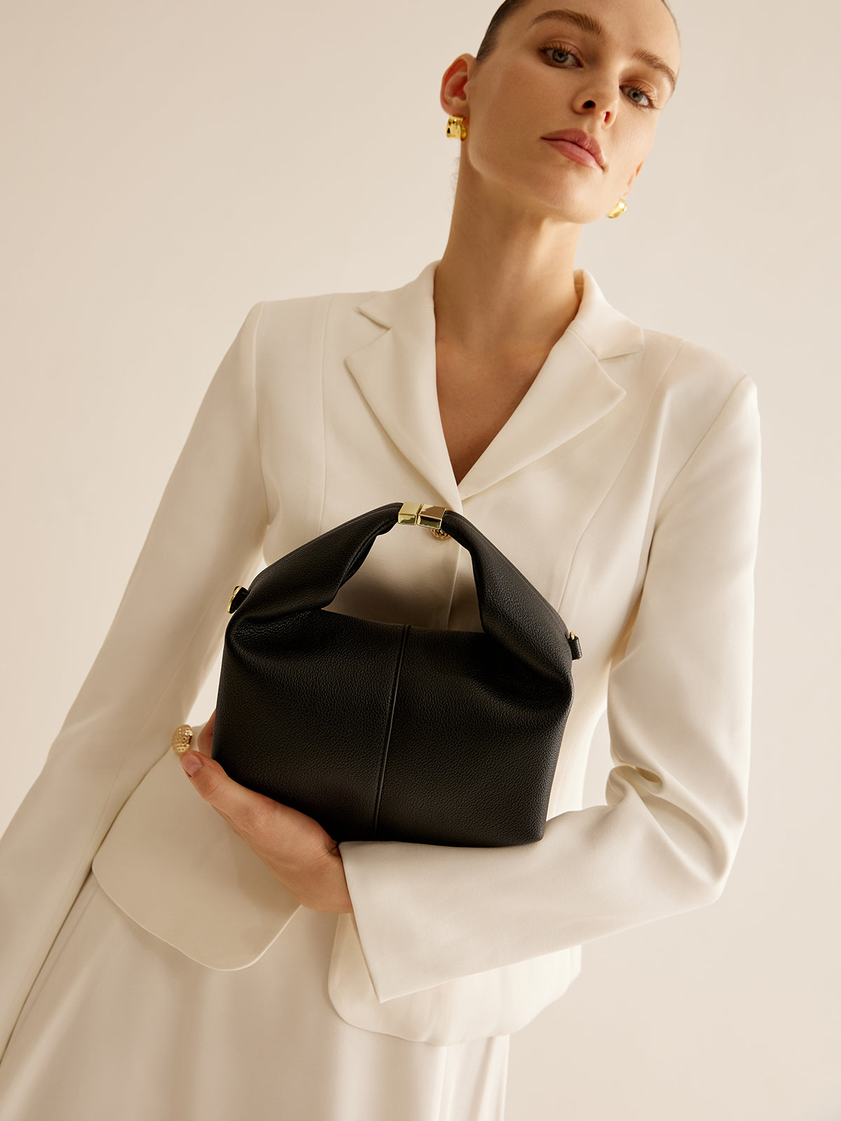 Sac à main rond avec détail en métal