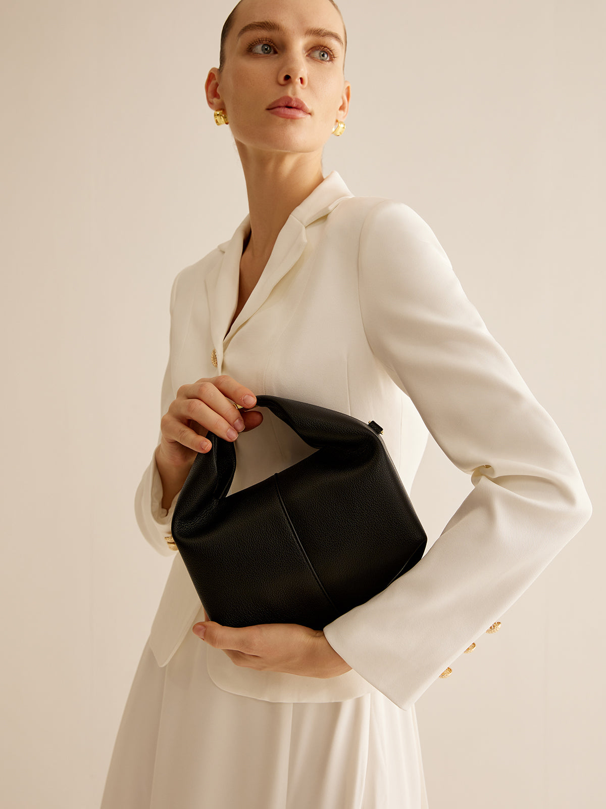 Sac à main rond avec détail en métal