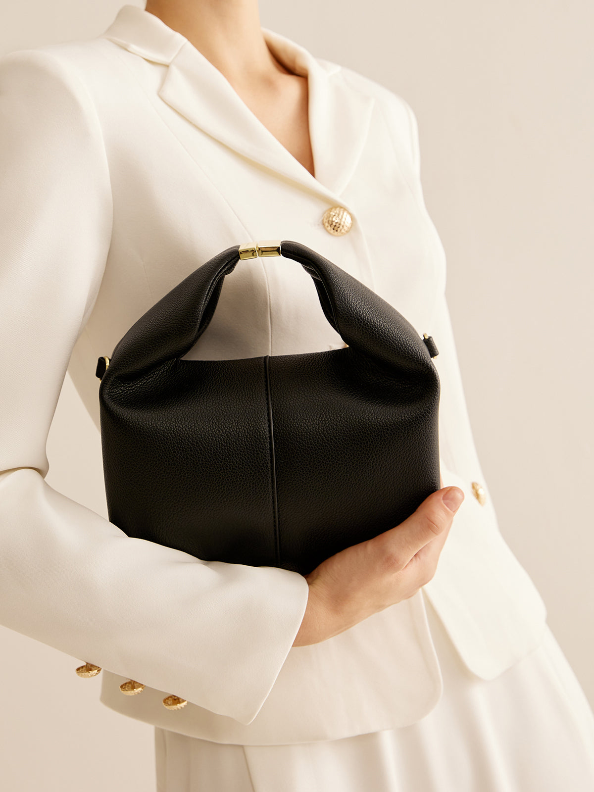 Sac à main rond avec détail en métal